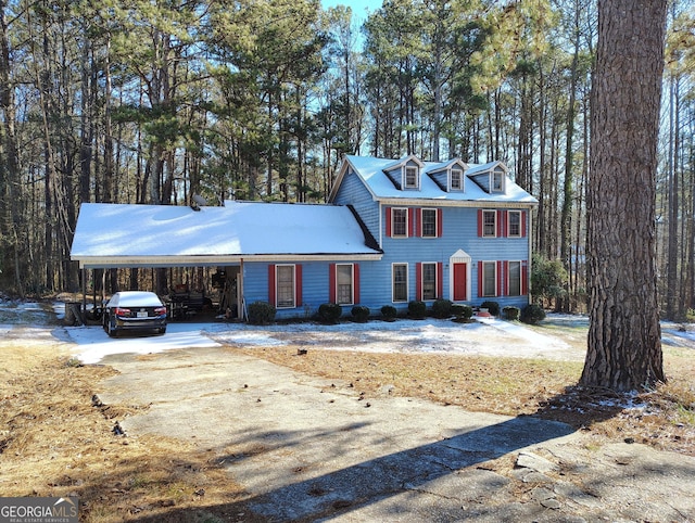 view of front of home with a carport