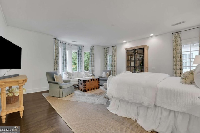 bedroom with dark hardwood / wood-style flooring