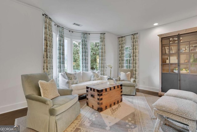 sitting room with hardwood / wood-style flooring