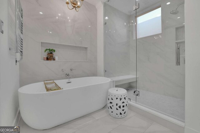 bathroom with radiator and a bathtub