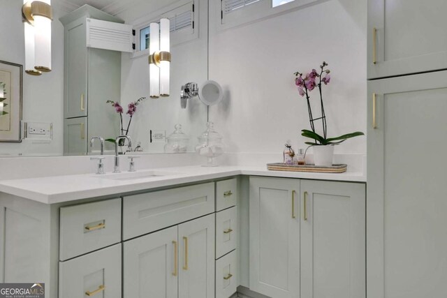 bathroom featuring vanity and a shower with shower door