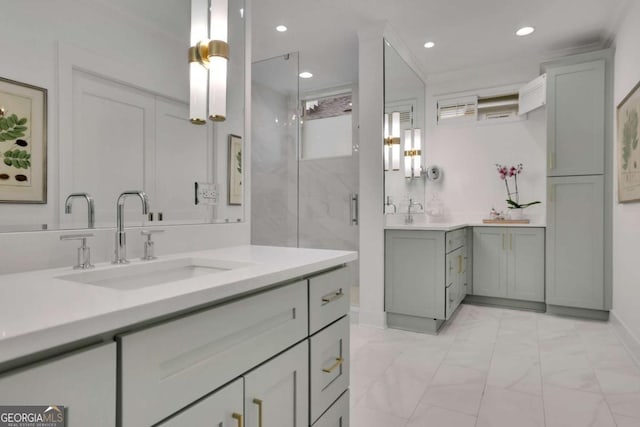 bathroom featuring ornamental molding, vanity, and a shower with shower door