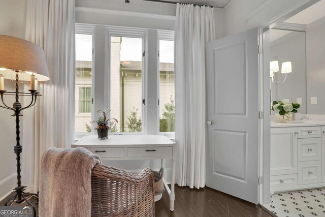 washroom featuring cabinets, washing machine and clothes dryer, and dark hardwood / wood-style floors