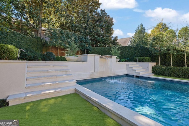 view of pool with pool water feature