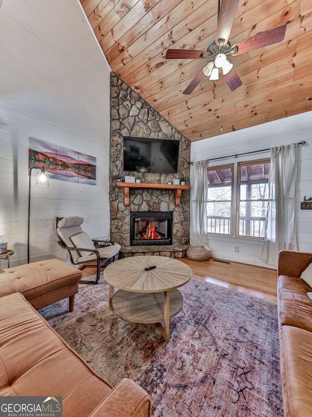 living room with high vaulted ceiling, a fireplace, hardwood / wood-style flooring, ceiling fan, and wooden ceiling