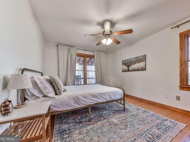 bedroom with hardwood / wood-style flooring and ceiling fan