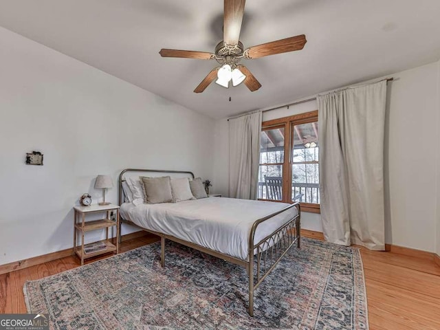 bedroom with hardwood / wood-style floors and ceiling fan