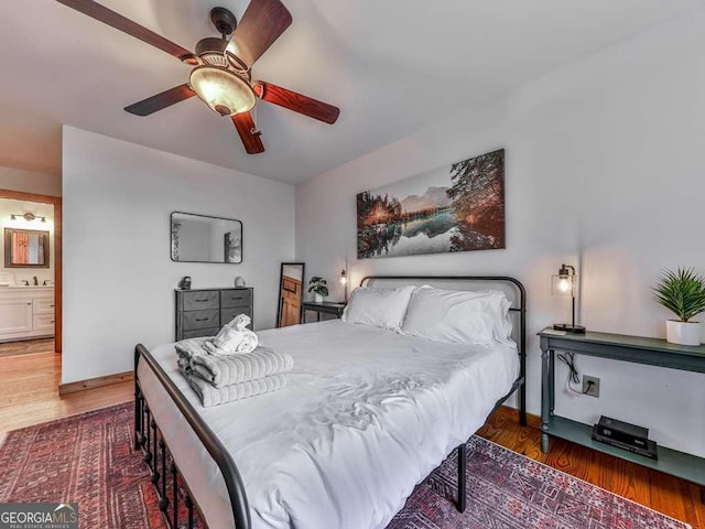 bedroom with dark wood-type flooring and ceiling fan