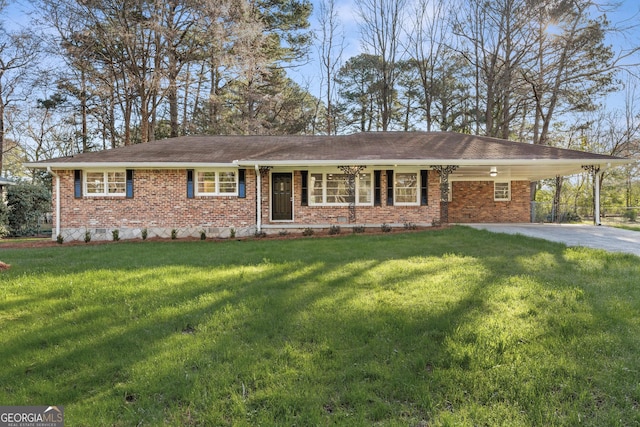 ranch-style home featuring a carport, driveway, brick siding, and a front lawn