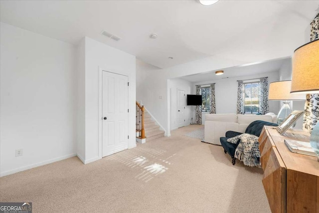 living room featuring light colored carpet