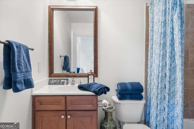 bathroom featuring vanity and toilet