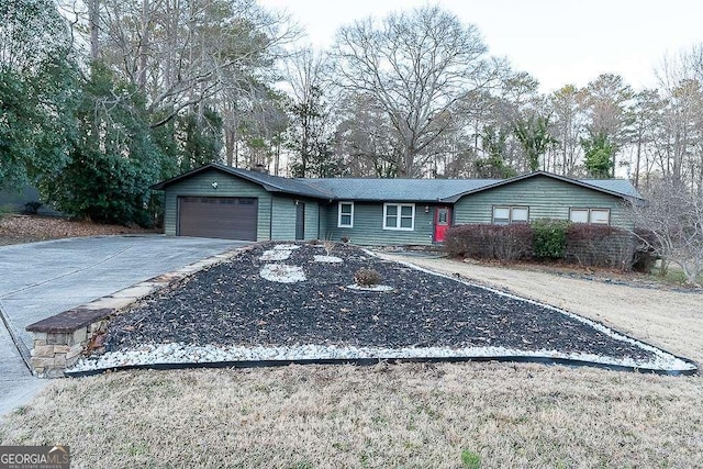 single story home featuring a garage