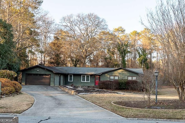 ranch-style home with a garage