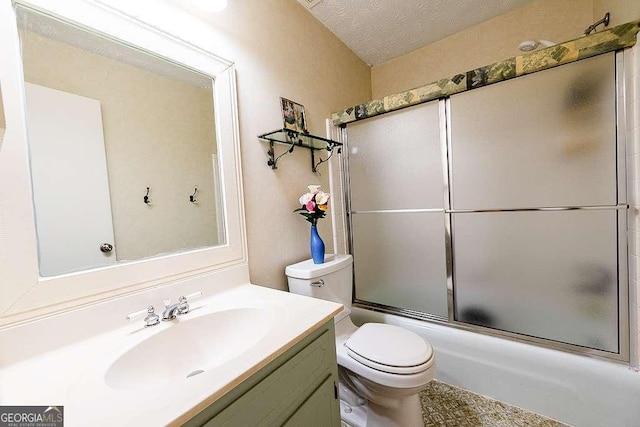 full bathroom featuring toilet, vanity, bath / shower combo with glass door, and a textured ceiling