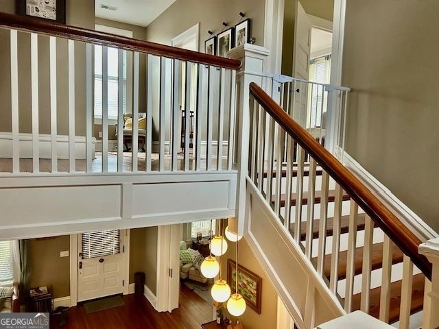 stairs featuring wood-type flooring