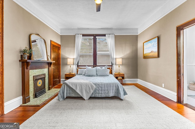 bedroom featuring ceiling fan and wood-type flooring