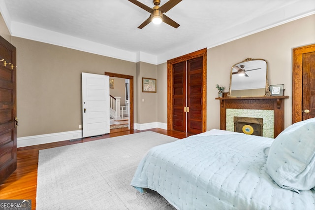 bedroom with hardwood / wood-style flooring and ceiling fan