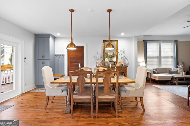 dining space featuring wood-type flooring