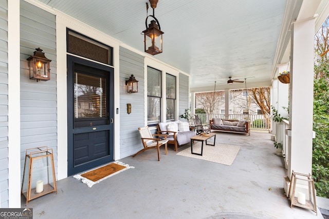 doorway to property featuring ceiling fan and covered porch