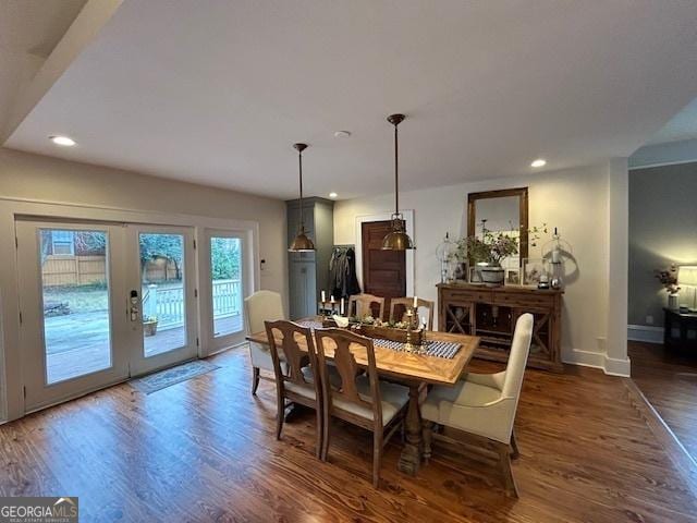 dining area featuring dark wood-type flooring and french doors