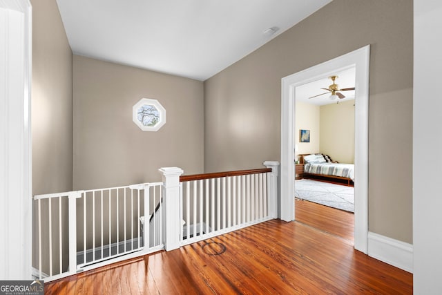 hall with wood-type flooring