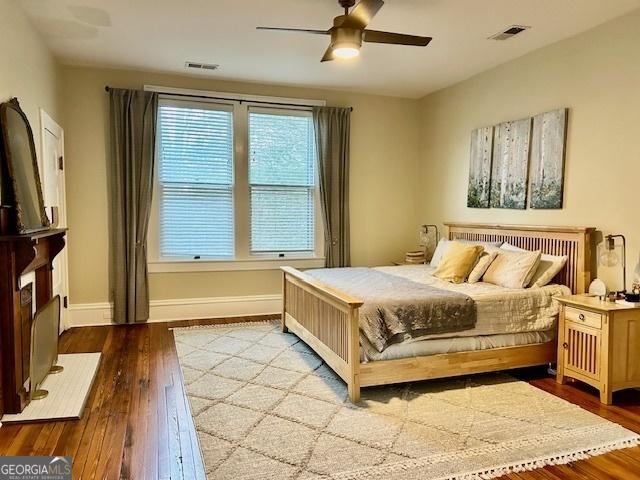 bedroom featuring ceiling fan and light hardwood / wood-style floors