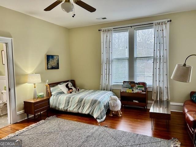 bedroom with ceiling fan and hardwood / wood-style floors