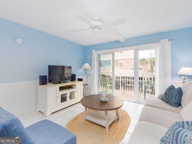 living room featuring ceiling fan and light tile patterned floors