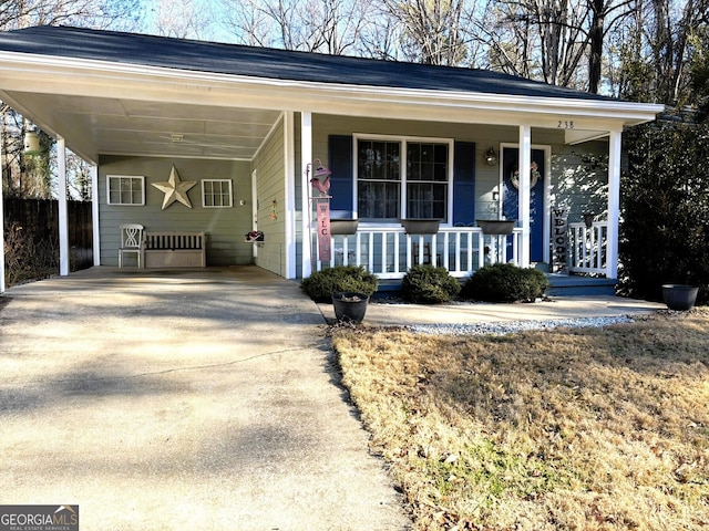 view of front of home featuring a carport and covered porch