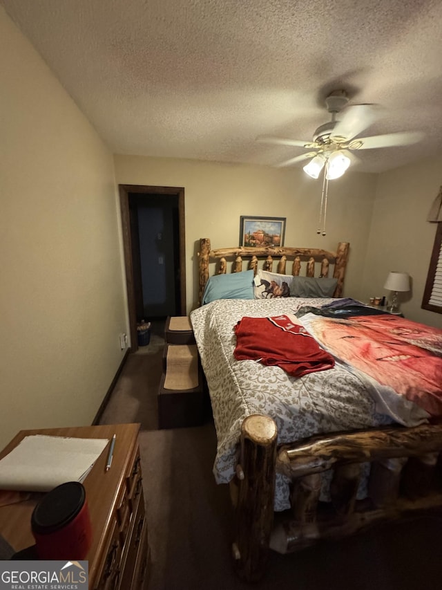 bedroom featuring a textured ceiling and ceiling fan