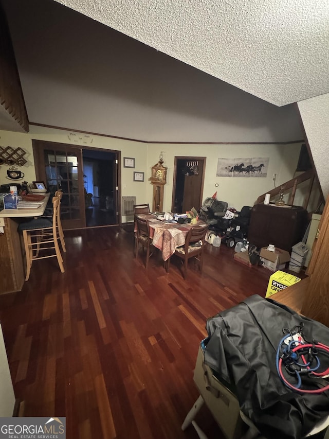 dining space with wood-type flooring