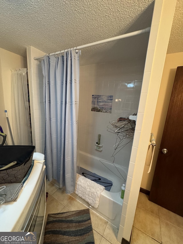 bathroom featuring a textured ceiling, tile patterned floors, and shower / bath combo