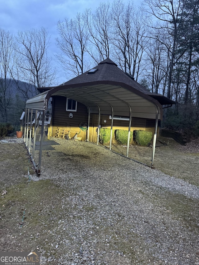 view of vehicle parking with a carport