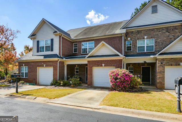 view of front of property featuring a garage and a front yard