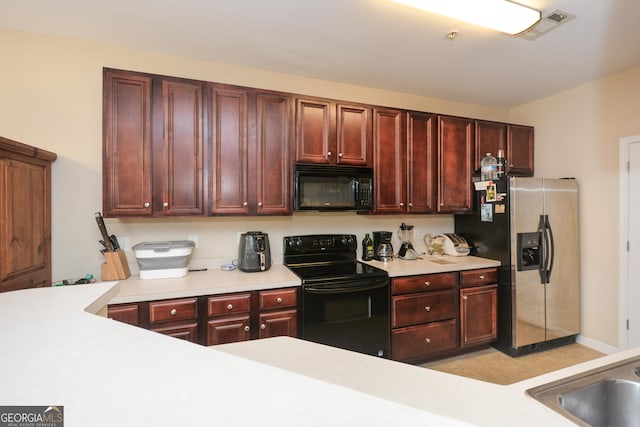 kitchen featuring sink and black appliances