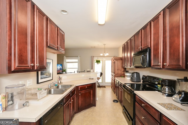 kitchen with sink, hanging light fixtures, kitchen peninsula, a notable chandelier, and black appliances