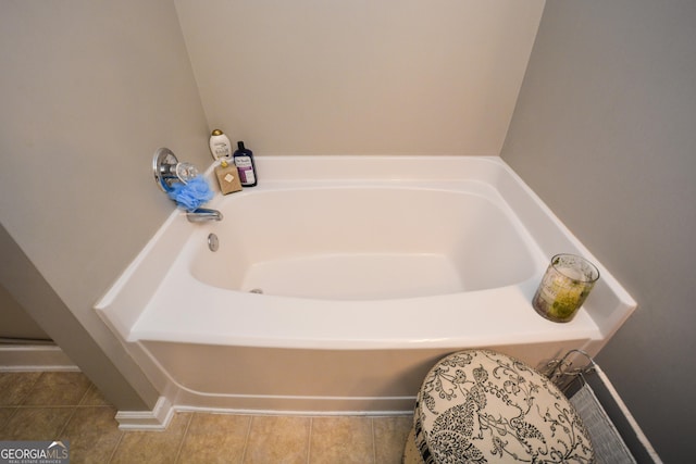 bathroom featuring tile patterned flooring and a washtub