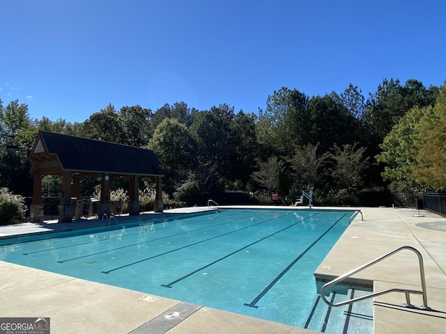 view of swimming pool with a gazebo and a patio area