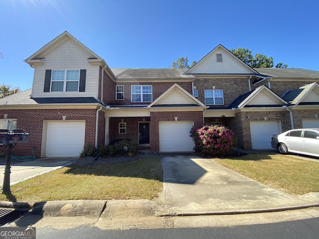 view of property featuring a garage and a front yard