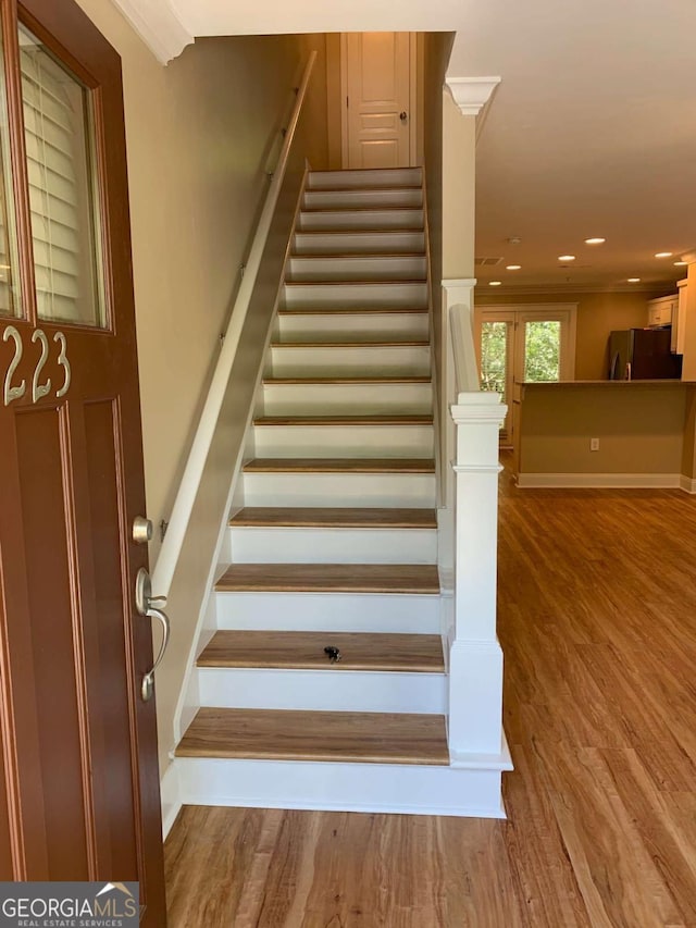 stairway featuring hardwood / wood-style floors