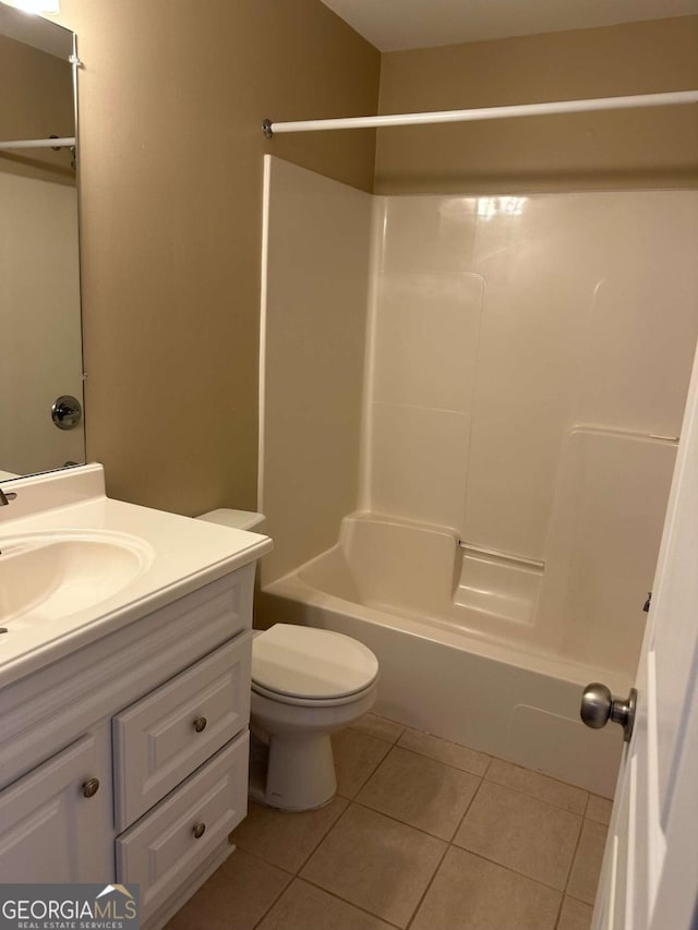 full bathroom featuring tile patterned flooring, vanity, bathing tub / shower combination, and toilet