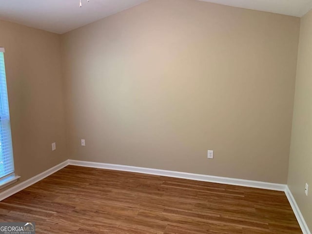 empty room with hardwood / wood-style floors