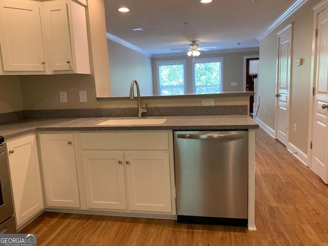 kitchen featuring white cabinetry, sink, stainless steel dishwasher, and kitchen peninsula