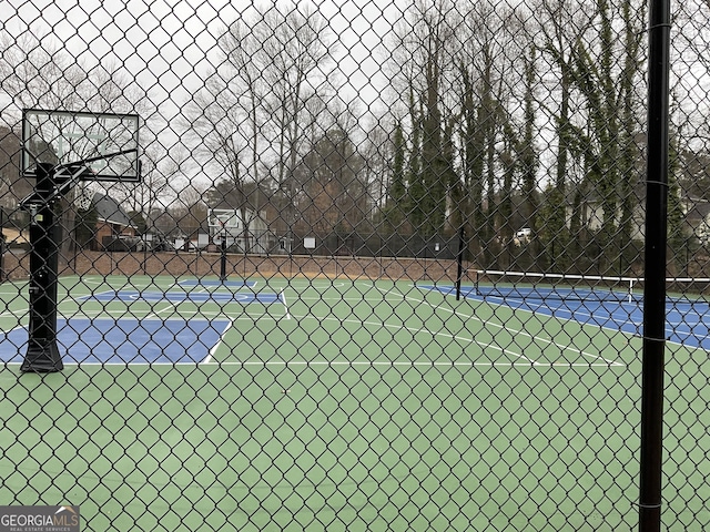 view of sport court with community basketball court and fence