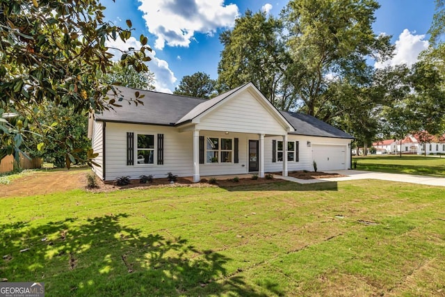 view of front of house with a garage and a front lawn