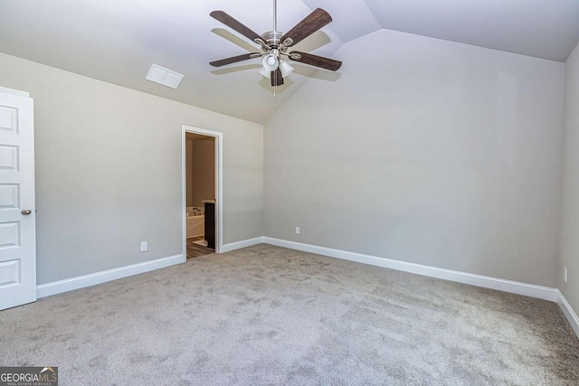 carpeted spare room with lofted ceiling and ceiling fan