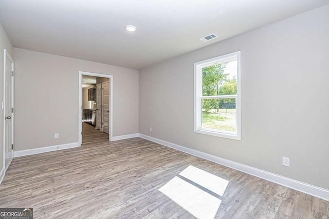 empty room featuring light hardwood / wood-style floors