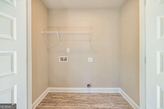 clothes washing area with hardwood / wood-style floors, hookup for an electric dryer, and washer hookup