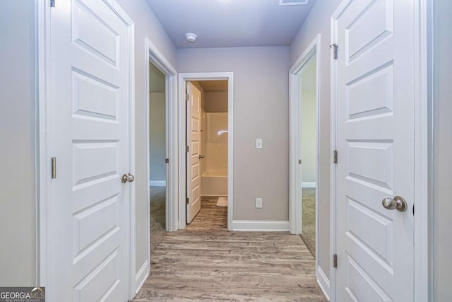 hall featuring light wood-type flooring