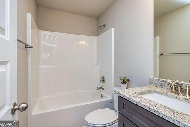 full bathroom featuring vanity,  shower combination, and toilet